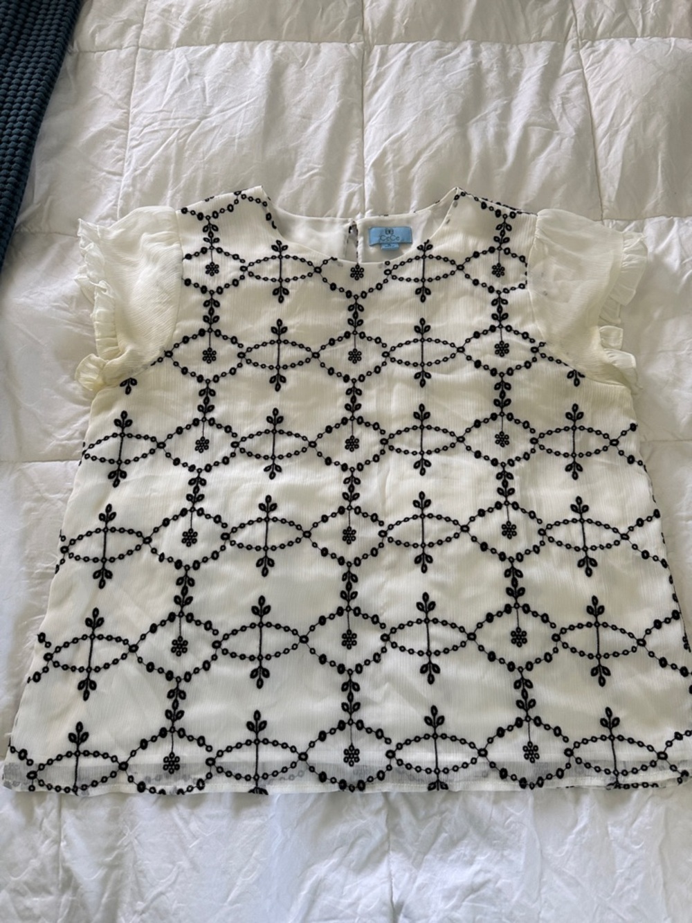 CeCe Cream Blouse with Black Embroidered Lattice